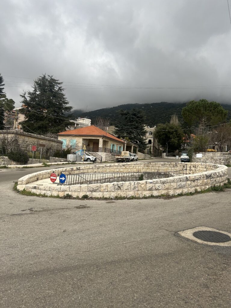 photo of the central square of maasser el shouf showing the roman well in the middle